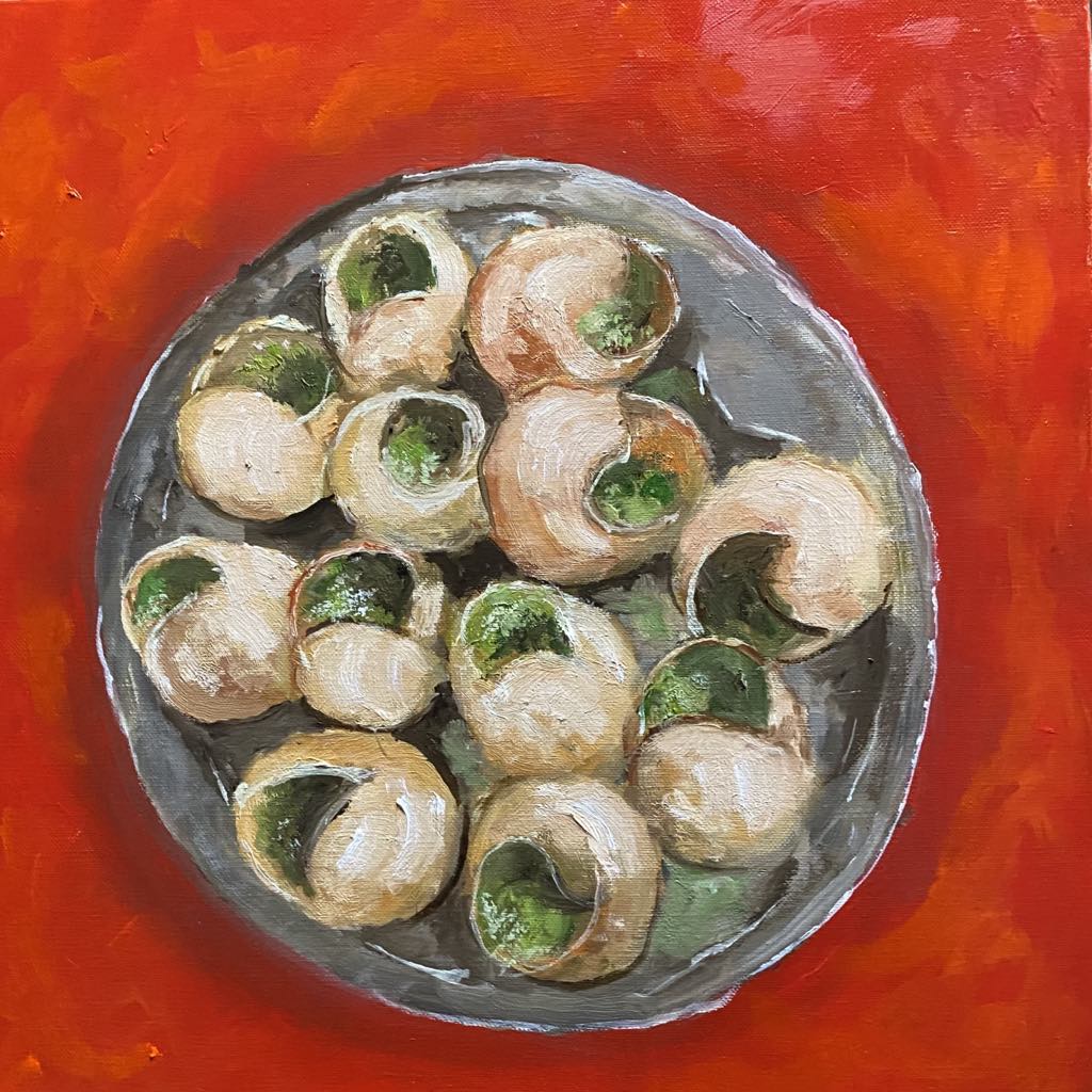 Escargot à déguster sur une nappe rouge vif